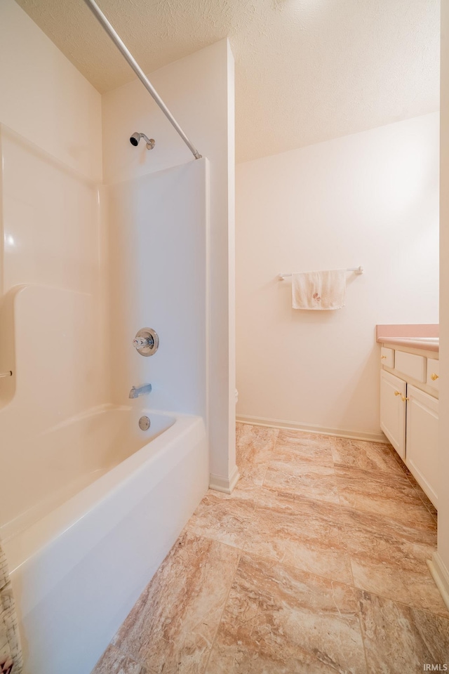 1843 Valley View Dr, Kokomo, IN 46902 - bathroom featuring vanity, shower / tub combination, toilet, and a textured ceiling
