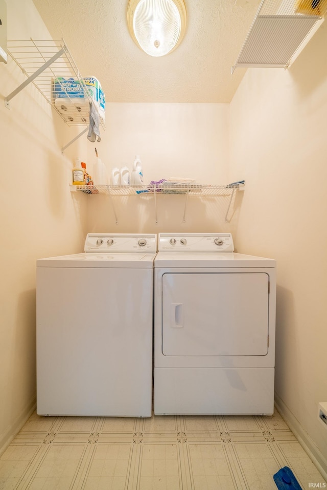1843 Valley View Dr, Kokomo, IN 46902 - washroom featuring separate washer and dryer, light floors, and baseboards
