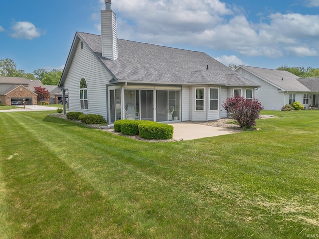 1843 Valley View Dr, Kokomo, IN 46902 - back of property with a shingled roof, a chimney, a lawn, a sunroom, and a patio area