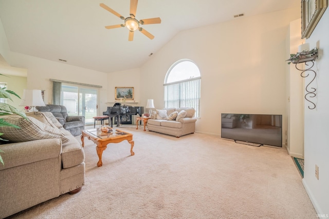 1843 Valley View Dr, Kokomo, IN 46902 - carpeted living room featuring ceiling fan, healthy amount of natural light, high vaulted ceiling, and baseboards