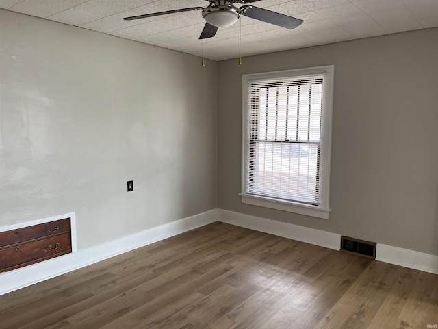 211 S Liberty St, Muncie, IN 47305 - unfurnished room featuring ceiling fan, wood finished floors, and baseboards