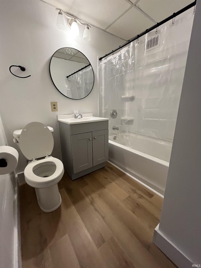 211 S Liberty St, Muncie, IN 47305 - full bath with toilet, vanity, wood finished floors, and shower / bath combination with curtain