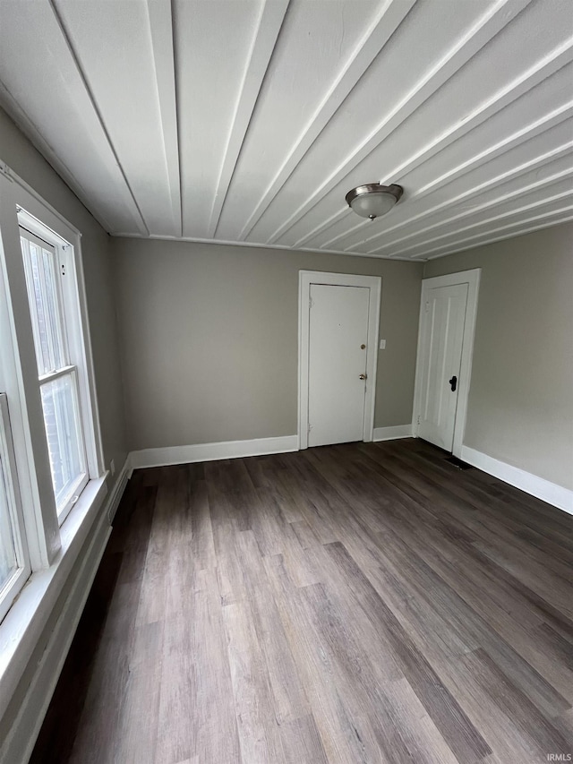 211 S Liberty St, Muncie, IN 47305 - empty room with dark wood-style flooring and baseboards