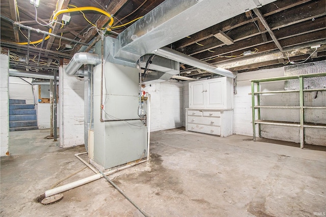 629 E 3rd St, Mishawaka, IN 46544 - unfinished below grade area with stairs, heating unit, and electric panel
