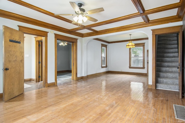 629 E 3rd St, Mishawaka, IN 46544 - spare room with arched walkways, ceiling fan, coffered ceiling, stairs, and baseboards