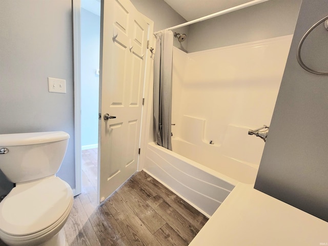1702 Milburn Blvd, Mishawaka, IN 46544 - bathroom with wood finished floors, toilet, and shower / bath combo