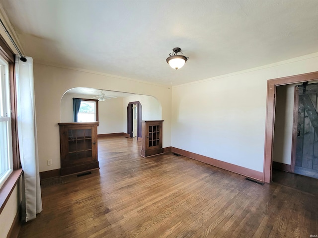 1702 Milburn Blvd, Mishawaka, IN 46544 - empty room with arched walkways, hardwood / wood-style floors, and baseboards