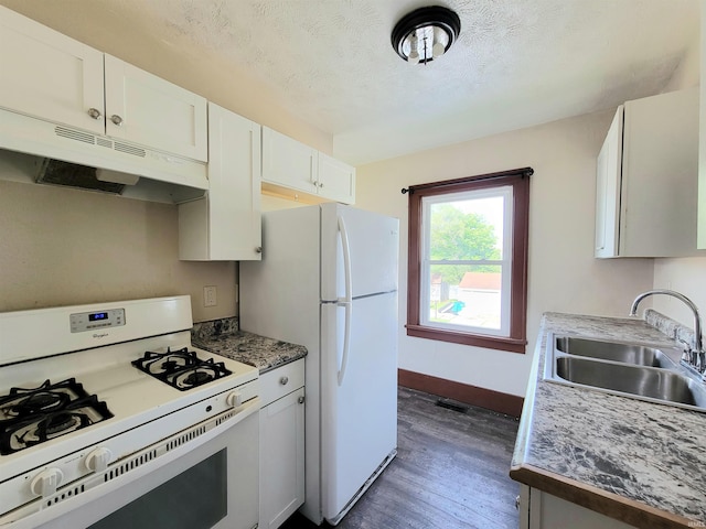 1702 Milburn Blvd, Mishawaka, IN 46544 - kitchen featuring white appliances, a sink, under cabinet range hood, dark wood-type flooring, and white cabinets
