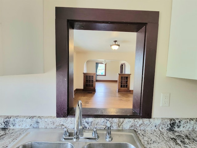 1702 Milburn Blvd, Mishawaka, IN 46544 - kitchen view of a sink, wood finished floors, and arched walkways