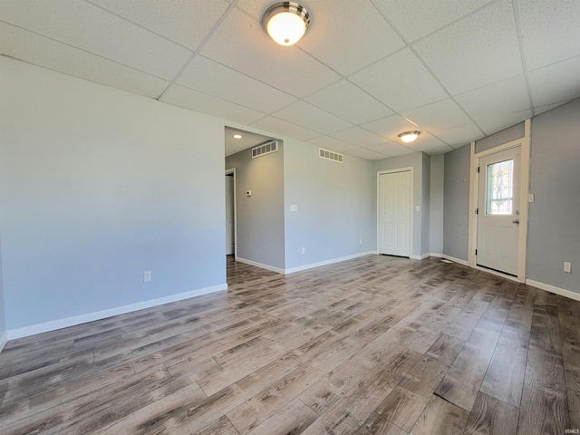 1702 Milburn Blvd, Mishawaka, IN 46544 - spare room with a paneled ceiling, wood finished floors, and baseboards