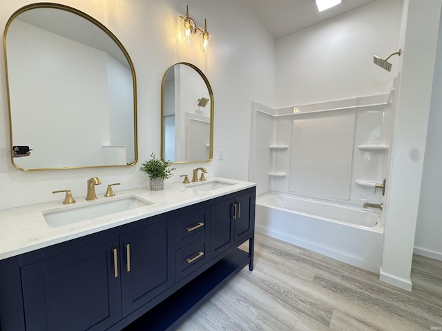 1114 N College St, Veedersburg, IN 47987 - full bathroom with wood finished floors, double vanity, and bathing tub / shower combination