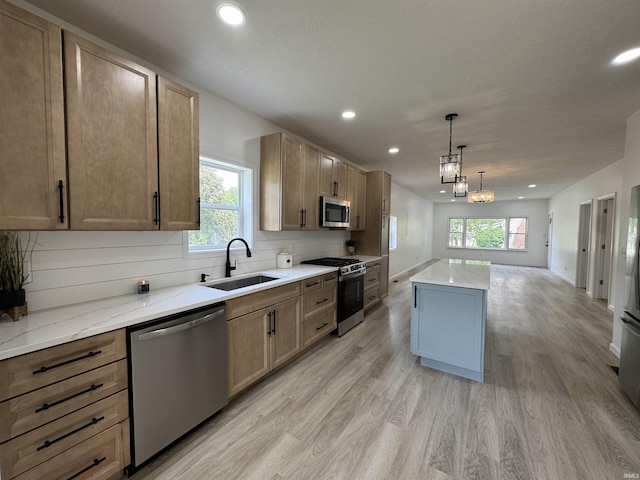 1114 N College St, Veedersburg, IN 47987 - kitchen with stainless steel appliances, a sink, light wood-style floors, recessed lighting, and healthy amount of natural light
