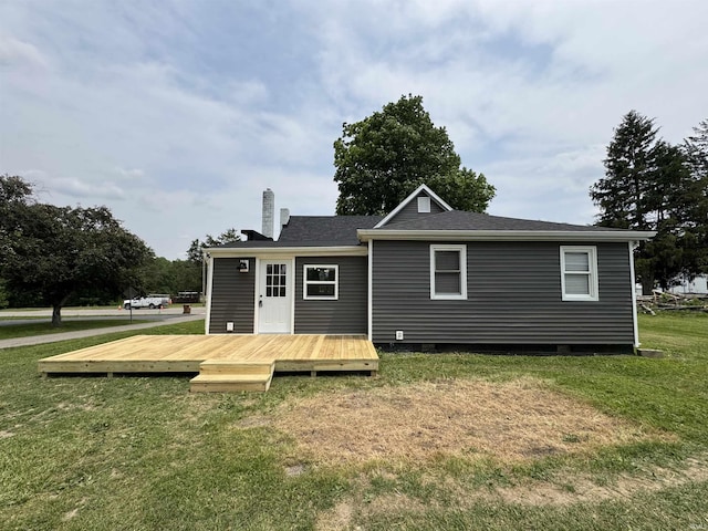 1114 N College St, Veedersburg, IN 47987 - back of property with a wooden deck, crawl space, a yard, and a chimney