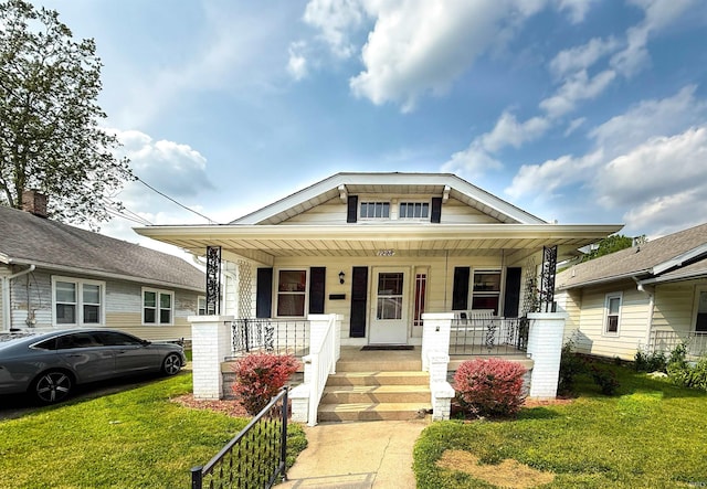 1228 Woodward Ave, New Castle, IN 47362 - bungalow with covered porch and a front yard