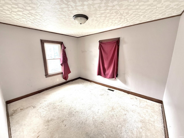 1228 Woodward Ave, New Castle, IN 47362 - carpeted empty room with ornamental molding and baseboards