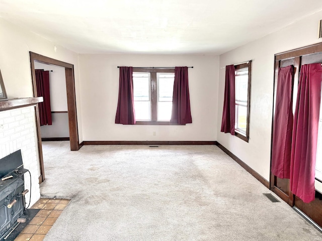1228 Woodward Ave, New Castle, IN 47362 - unfurnished living room featuring light colored carpet and baseboards