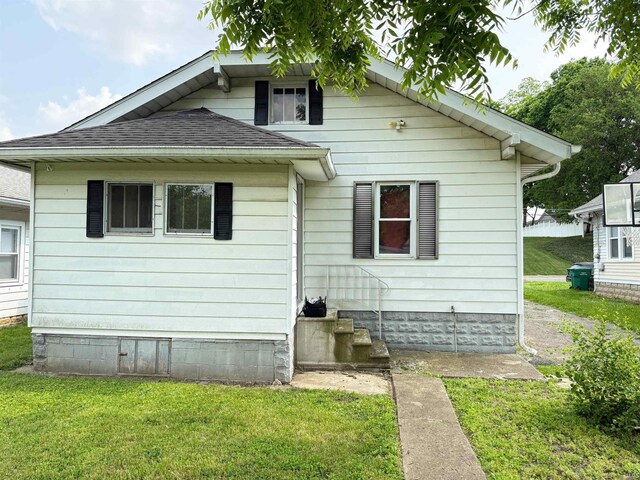 1228 Woodward Ave, New Castle, IN 47362 - back of house featuring a yard and a shingled roof