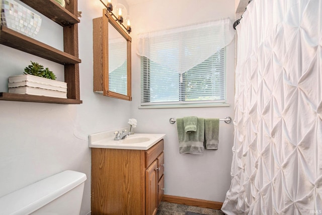 5209 Sunnyfield Pl, South Bend, IN 46619 - bathroom featuring vanity, toilet, curtained shower, and baseboards