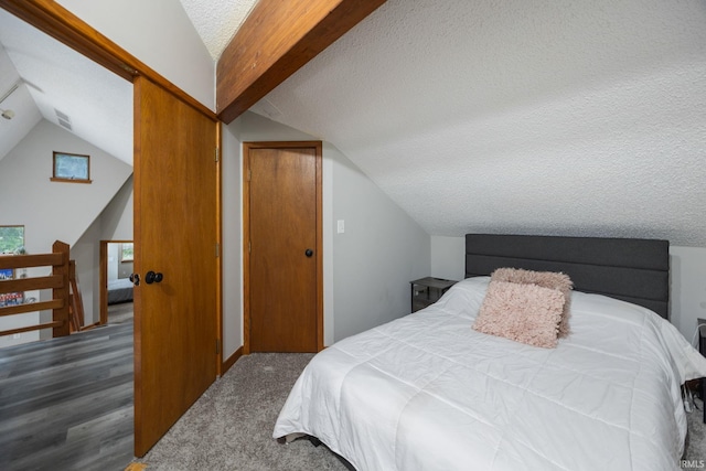 411 N 400 W, West Lafayette, IN 47906 - bedroom with a textured ceiling, lofted ceiling, wood finished floors, and baseboards