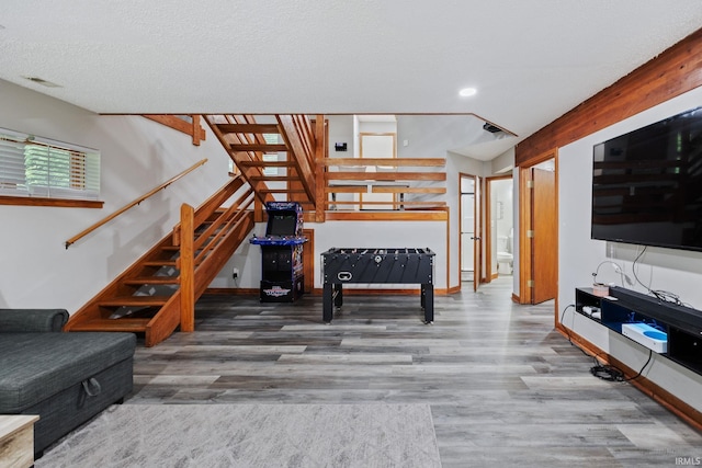 411 N 400 W, West Lafayette, IN 47906 - unfurnished living room featuring stairs, wood finished floors, and recessed lighting