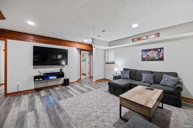 411 N 400 W, West Lafayette, IN 47906 - living room featuring a textured ceiling, wood finished floors, baseboards, and recessed lighting