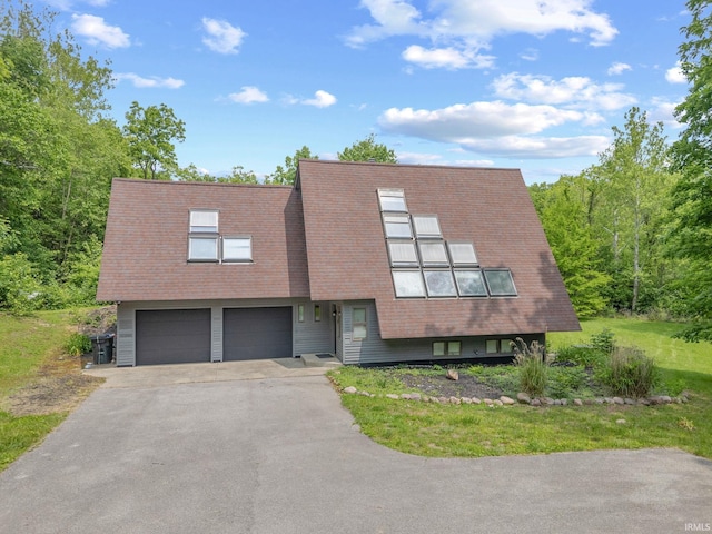 411 N 400 W, West Lafayette, IN 47906 - view of front facade with a garage and asphalt driveway