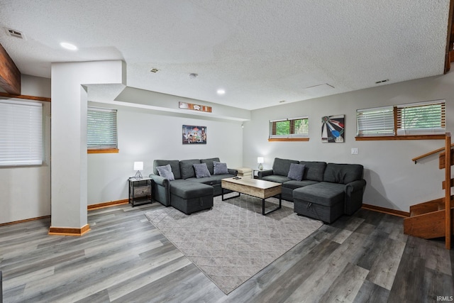 411 N 400 W, West Lafayette, IN 47906 - living area featuring baseboards, wood finished floors, a textured ceiling, and recessed lighting