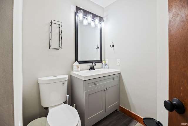 411 N 400 W, West Lafayette, IN 47906 - half bathroom with toilet, vanity, wood finished floors, and baseboards