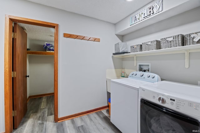 411 N 400 W, West Lafayette, IN 47906 - washroom with washer and clothes dryer, light wood-style flooring, baseboards, and a textured ceiling