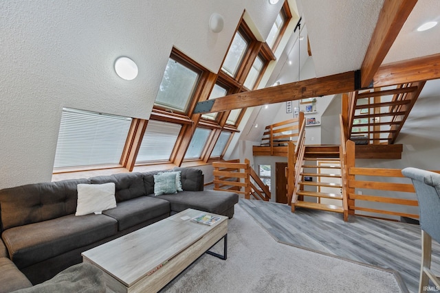 411 N 400 W, West Lafayette, IN 47906 - living area with a textured wall, stairway, wood finished floors, beam ceiling, and high vaulted ceiling