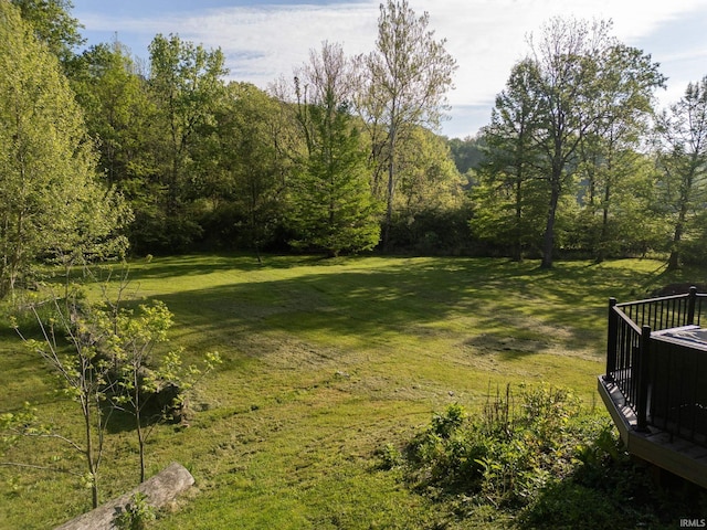 411 N 400 W, West Lafayette, IN 47906 - view of green lawn featuring a wooden deck and a wooded view