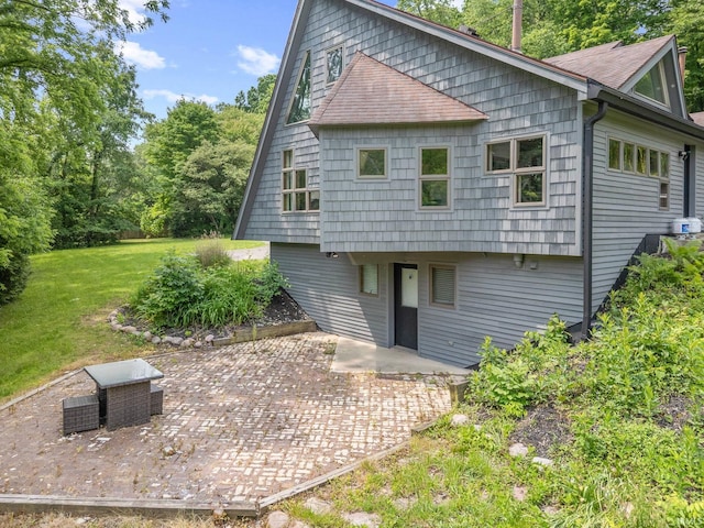 411 N 400 W, West Lafayette, IN 47906 - back of house with a patio, a yard, and roof with shingles