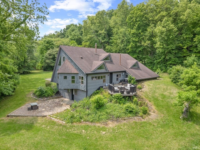 411 N 400 W, West Lafayette, IN 47906 - view of front of house with a deck, a front yard, and a view of trees