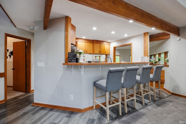 411 N 400 W, West Lafayette, IN 47906 - kitchen featuring baseboards, beam ceiling, wood finished floors, recessed lighting, and a textured ceiling