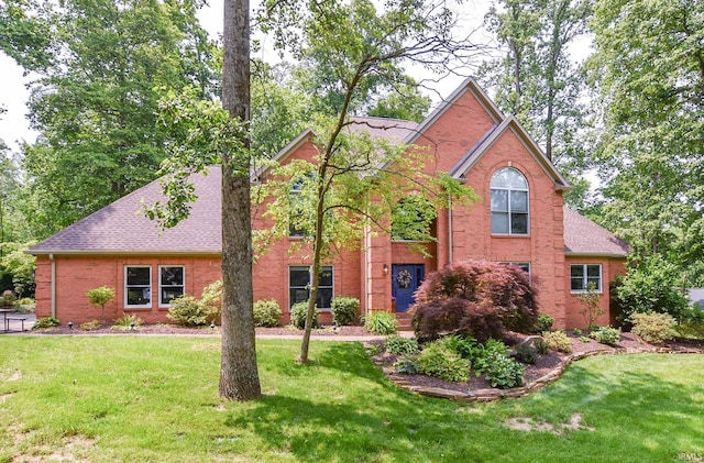 11130 Summitree Ct, Evansville, IN 47725 - view of front of property with brick siding, a front lawn, and a shingled roof