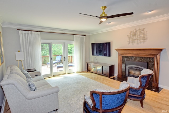 11130 Summitree Ct, Evansville, IN 47725 - living area with crown molding, wood finished floors, a ceiling fan, and a fireplace