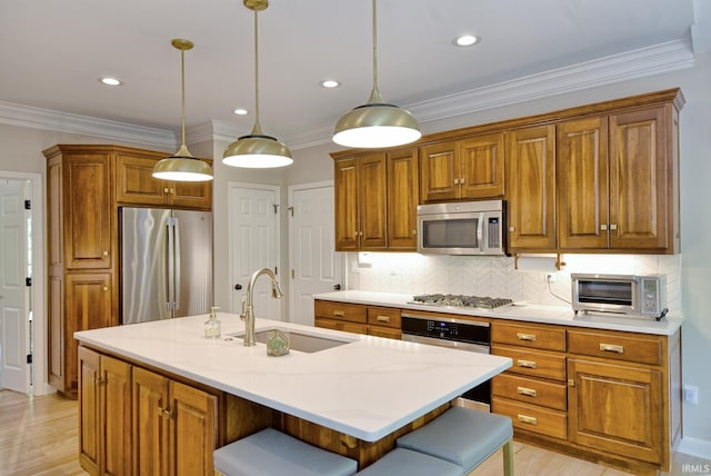 11130 Summitree Ct, Evansville, IN 47725 - kitchen featuring stainless steel appliances, a sink, brown cabinetry, tasteful backsplash, and a center island with sink