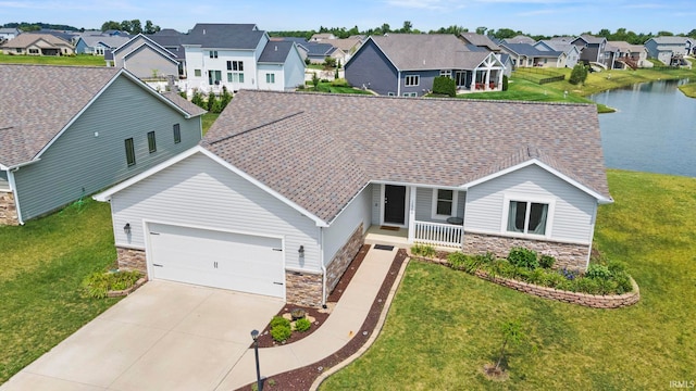 12946 Magnolia Creek Trl, Fort Wayne, IN 46814 - view of front of house with stone siding, a residential view, a porch, driveway, and a water view