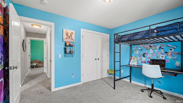 12946 Magnolia Creek Trl, Fort Wayne, IN 46814 - carpeted bedroom with baseboards, a closet, and a textured ceiling