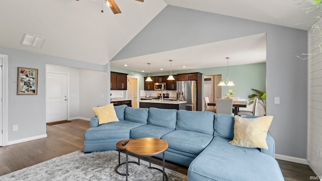 12946 Magnolia Creek Trl, Fort Wayne, IN 46814 - living area with dark wood-type flooring, ceiling fan, high vaulted ceiling, recessed lighting, and baseboards