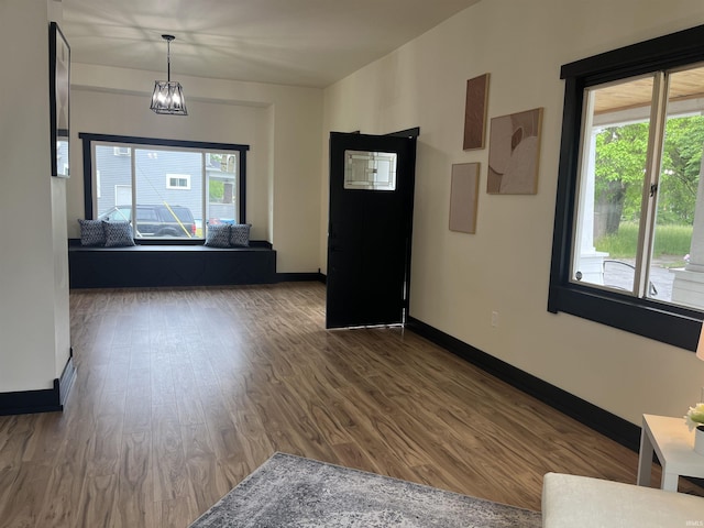 1302 Linden Ave, South Bend, IN 46628 - interior space with healthy amount of natural light, wood finished floors, baseboards, and a chandelier