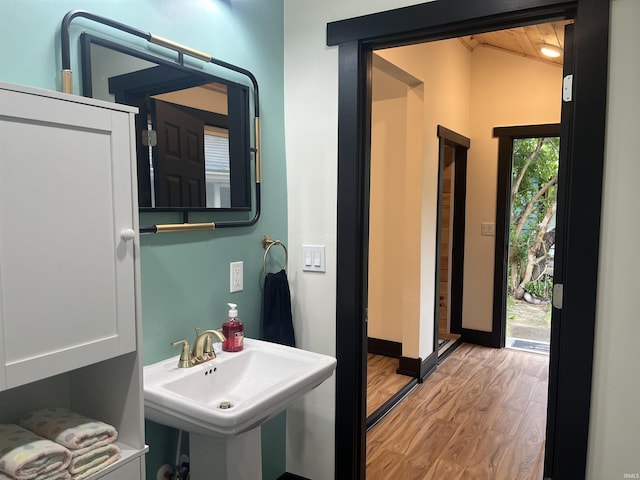 1302 Linden Ave, South Bend, IN 46628 - bathroom featuring lofted ceiling, wood finished floors, a sink, and wood ceiling