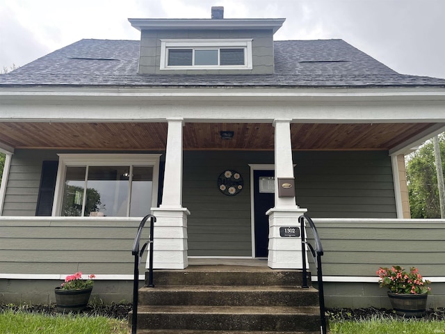 1302 Linden Ave, South Bend, IN 46628 - property entrance featuring roof with shingles and a porch