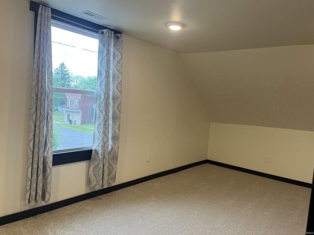 1302 Linden Ave, South Bend, IN 46628 - additional living space featuring carpet floors, lofted ceiling, and baseboards