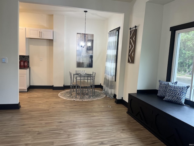 1302 Linden Ave, South Bend, IN 46628 - dining room featuring light wood-type flooring and baseboards