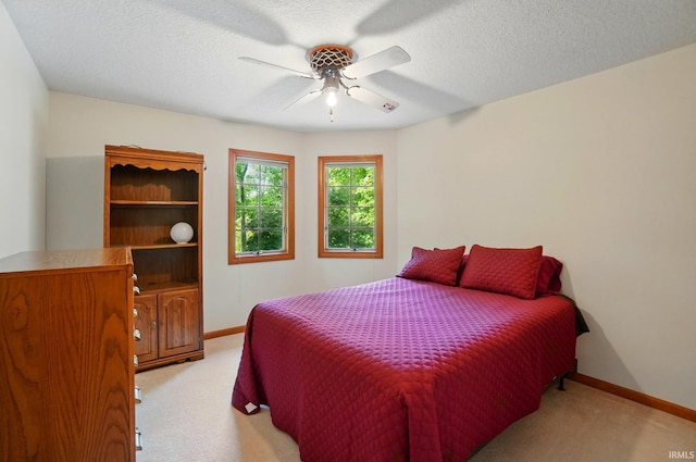 6011 W Wallen Rd, Fort Wayne, IN 46818 - bedroom featuring light colored carpet, baseboards, ceiling fan, and a textured ceiling