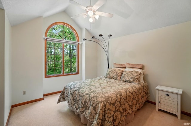 6011 W Wallen Rd, Fort Wayne, IN 46818 - bedroom with light carpet, baseboards, lofted ceiling, and ceiling fan
