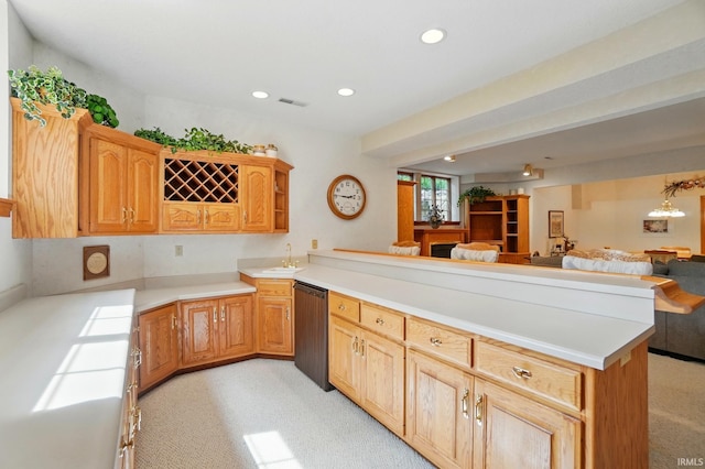 6011 W Wallen Rd, Fort Wayne, IN 46818 - kitchen with a peninsula, open floor plan, light colored carpet, a sink, and light countertops