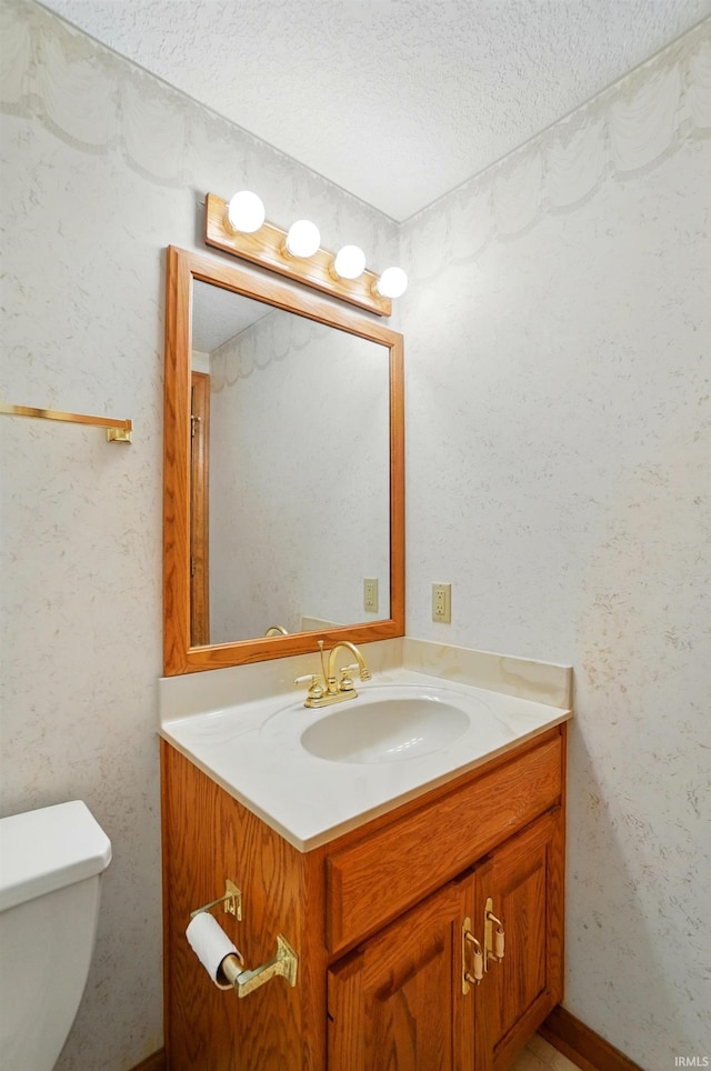 6011 W Wallen Rd, Fort Wayne, IN 46818 - half bathroom with a textured ceiling, vanity, and toilet