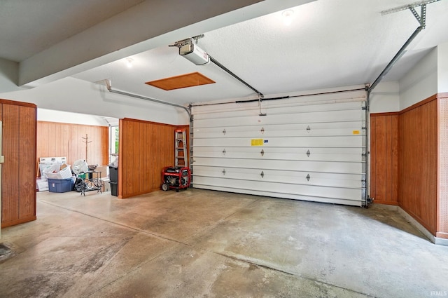 6011 W Wallen Rd, Fort Wayne, IN 46818 - garage with a garage door opener and wooden walls